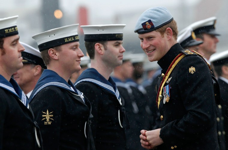 Image: Britain's Prince Harry,  presents Operational Service Medals to members of the First and Second Mine Countermeasures Squadrons at the Naval Base, in Portsmouth